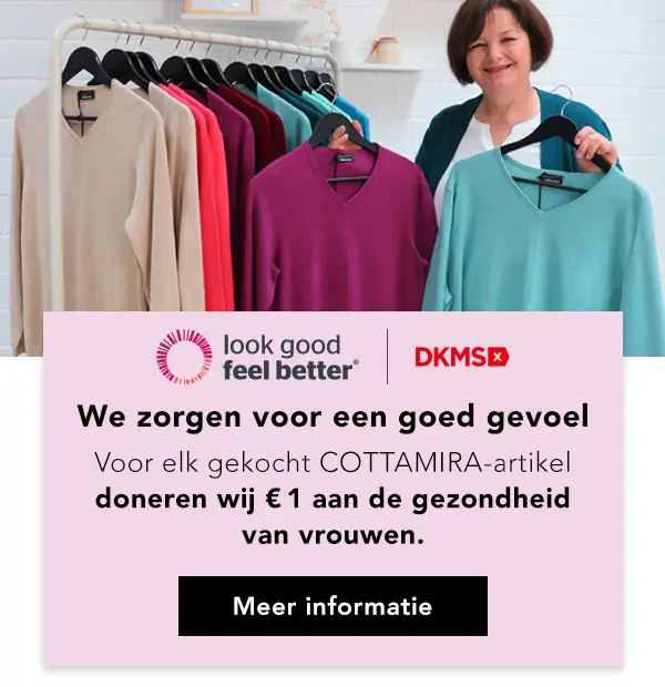 Een vrouw staat naast een kledingrek met kleurrijke truien en maakt reclame voor een liefdadigheidsinitiatief voor de gezondheid van vrouwen.