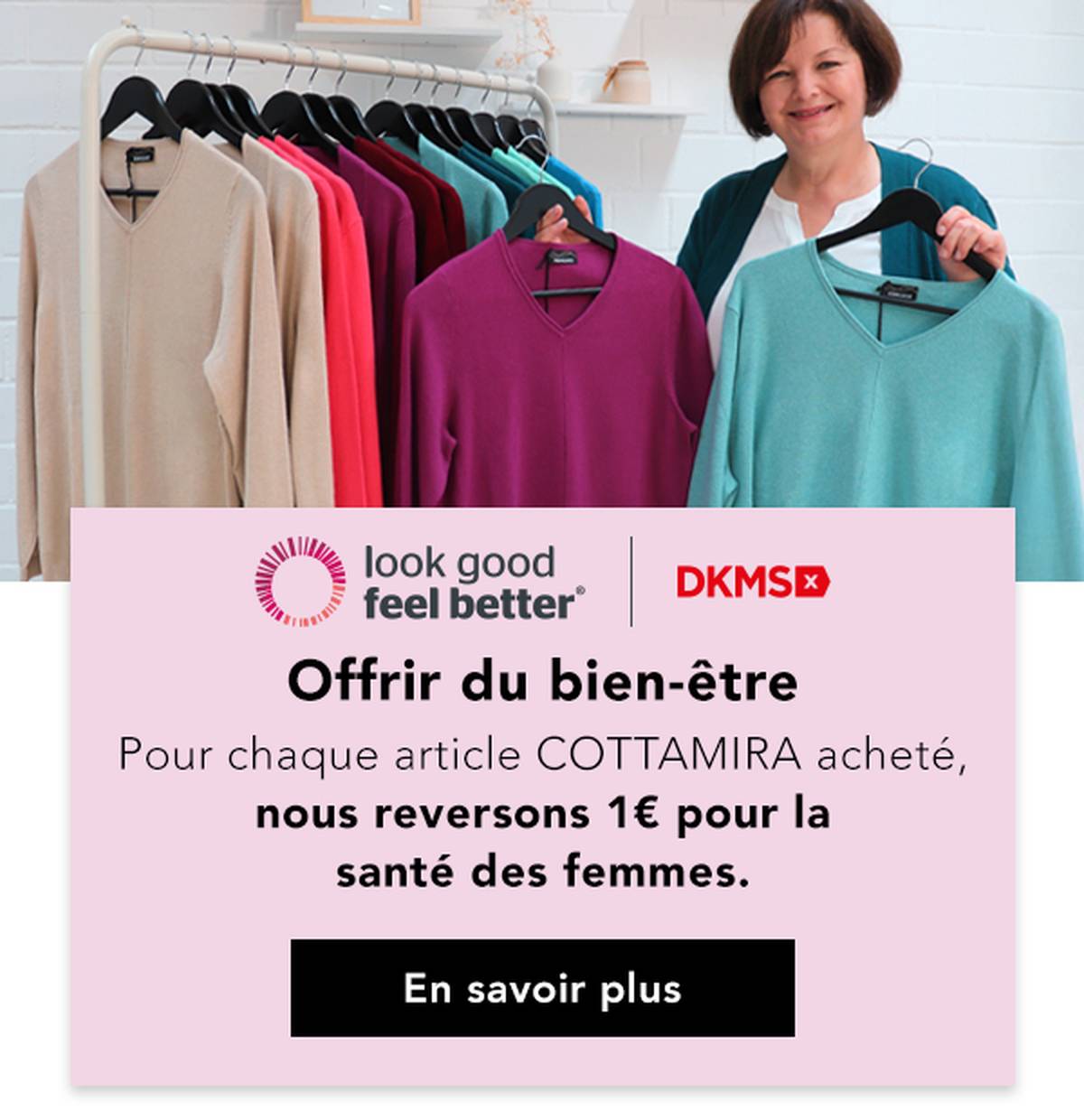 Une femme se tient à côté d'un portemanteau sur lequel sont accrochés des pulls colorés et fait la promotion d'une initiative caritative en faveur de la santé des femmes.