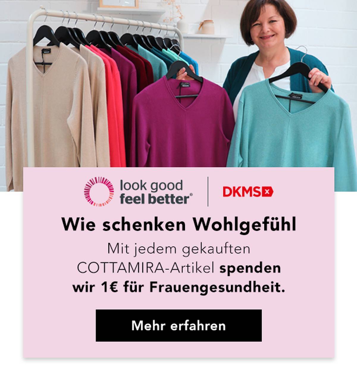 Eine Frau steht neben einem Kleiderständer mit bunten Pullovern und wirbt für eine Wohltätigkeitsinitiative für die Gesundheit von Frauen.