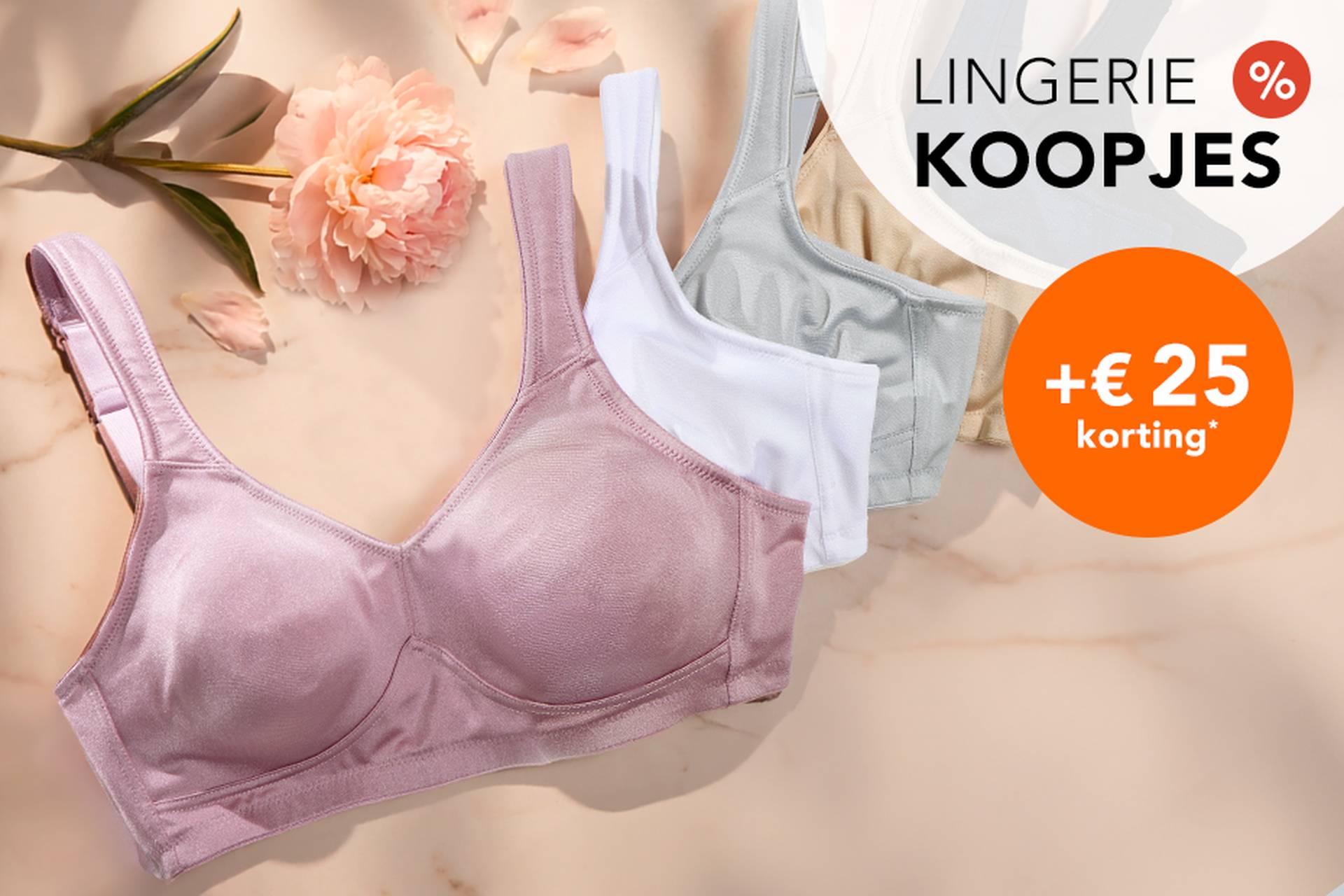  Drie beha’s in zachte kleuren liggen op een ondergrond, met daarnaast een bloem. In de aanbiedingstekst wordt gewezen op kortingen tot 70% en nog eens 20% extra korting.
