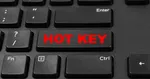 Cận cảnh một bàn phím màu đen với một phím lớn nằm giữa phím Shift và Ctrl, trên đó có dòng chữ “HOT KEY” màu đỏ đậm.