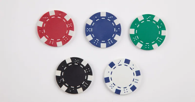 A collection of poker chips illustrating the importance of building a solid foundation during the first blind levels.