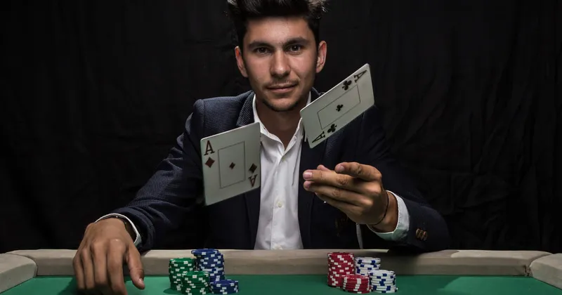 Man Throwing Two Aces into the Air with stacks of chips on a green table