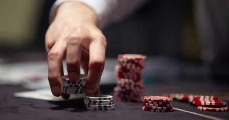 Hand holding poker chips