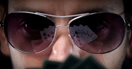 Men in glasses, cards reflected on glasses