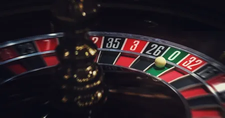 A roulette table with the white ball landed on 0