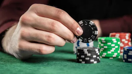 Man with stack of chips