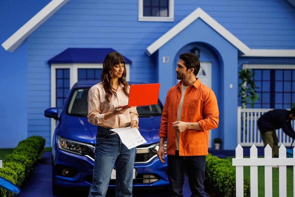 woman reacts to her new car insurance rate in an Insurify commercial