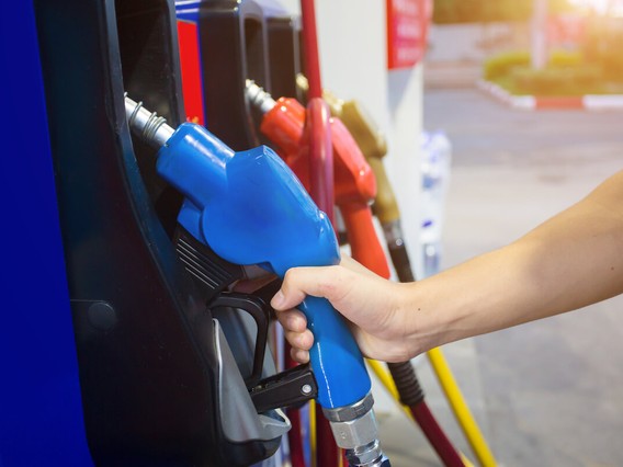 Person holding gas pump