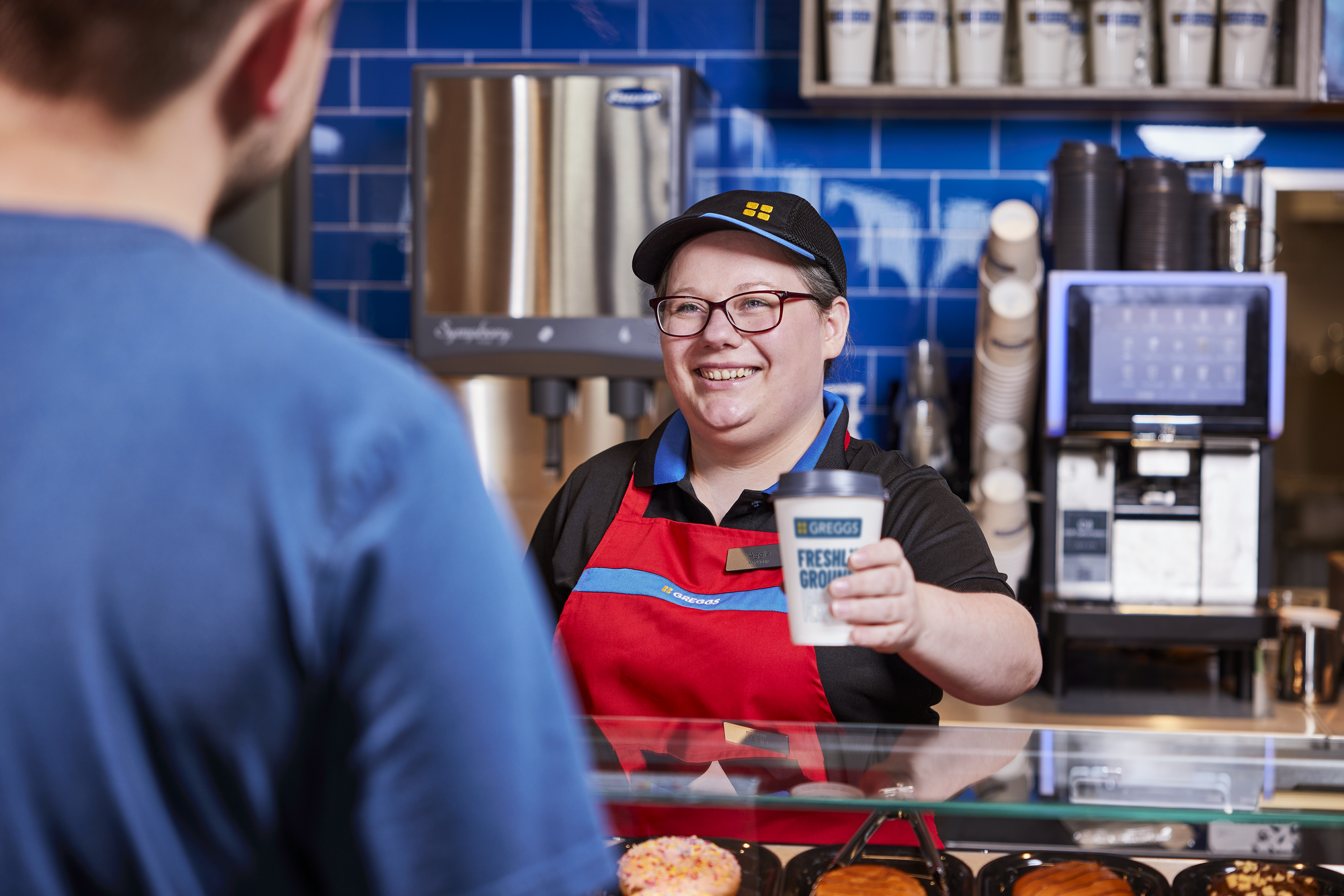 Colleague handing over drink