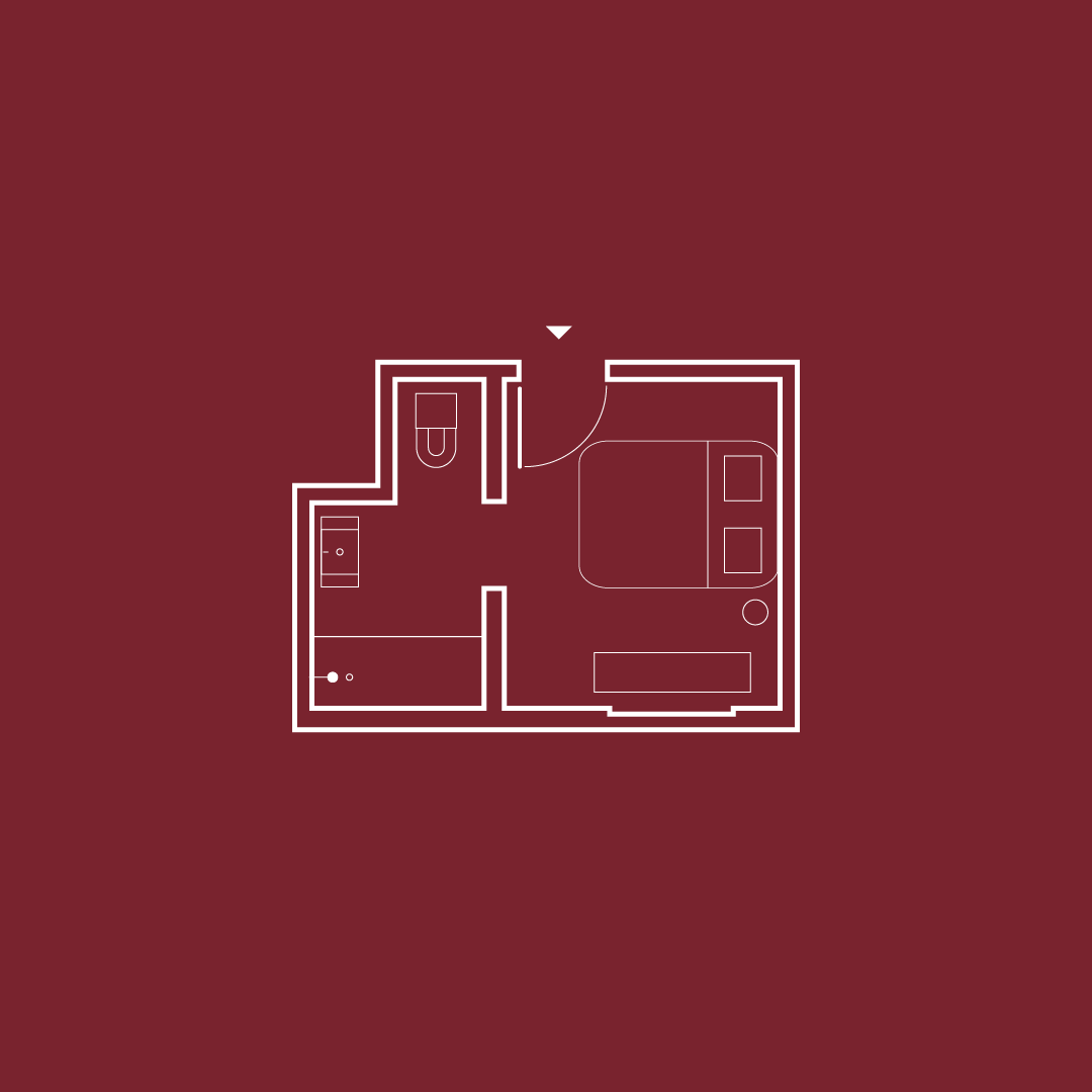Simple floor plan on a maroon background featuring a bed, desk, and bathroom layout.