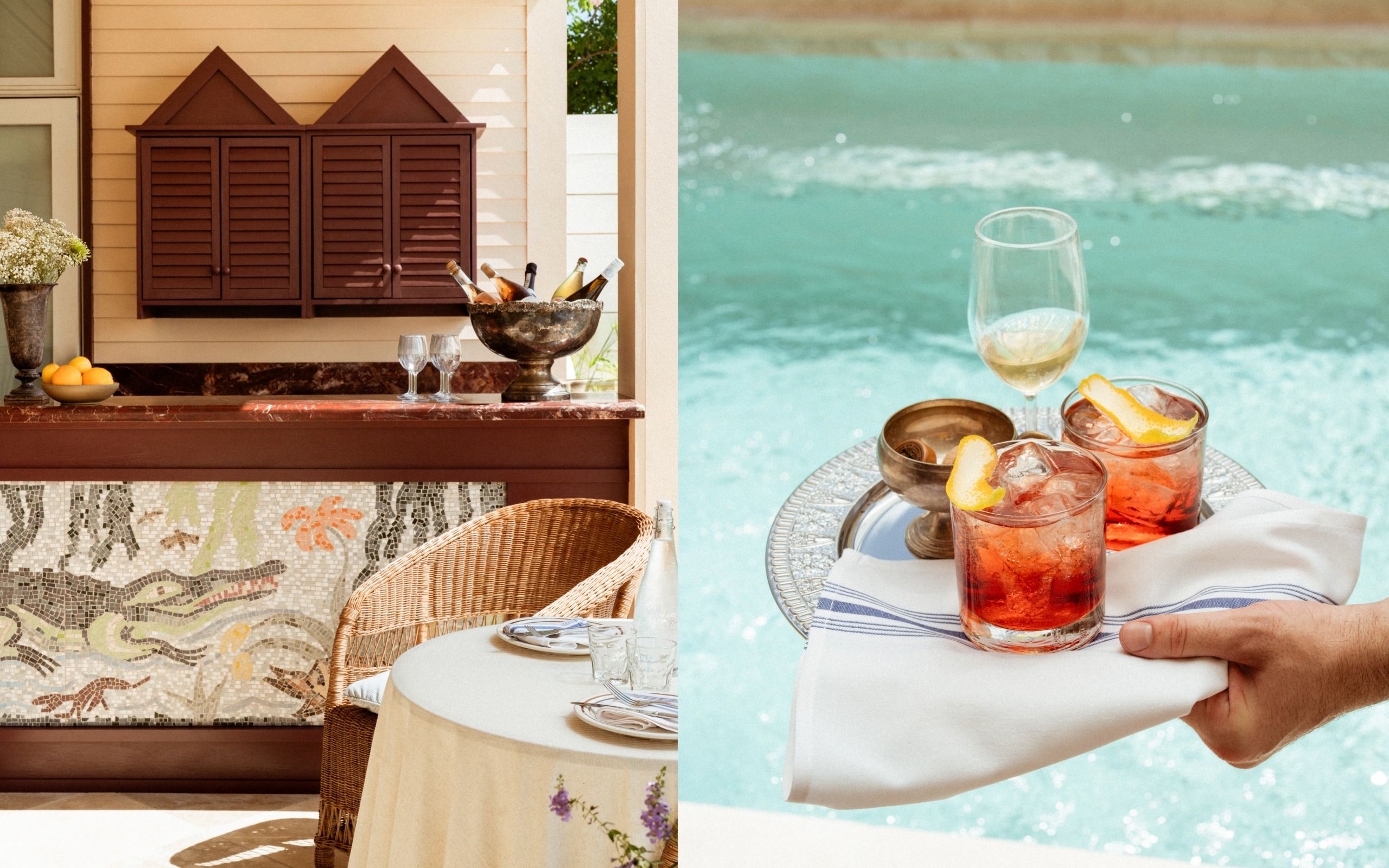 Outdoor setup with a mosaic bar and wicker furniture; a hand holds a tray with drinks beside a swimming pool.