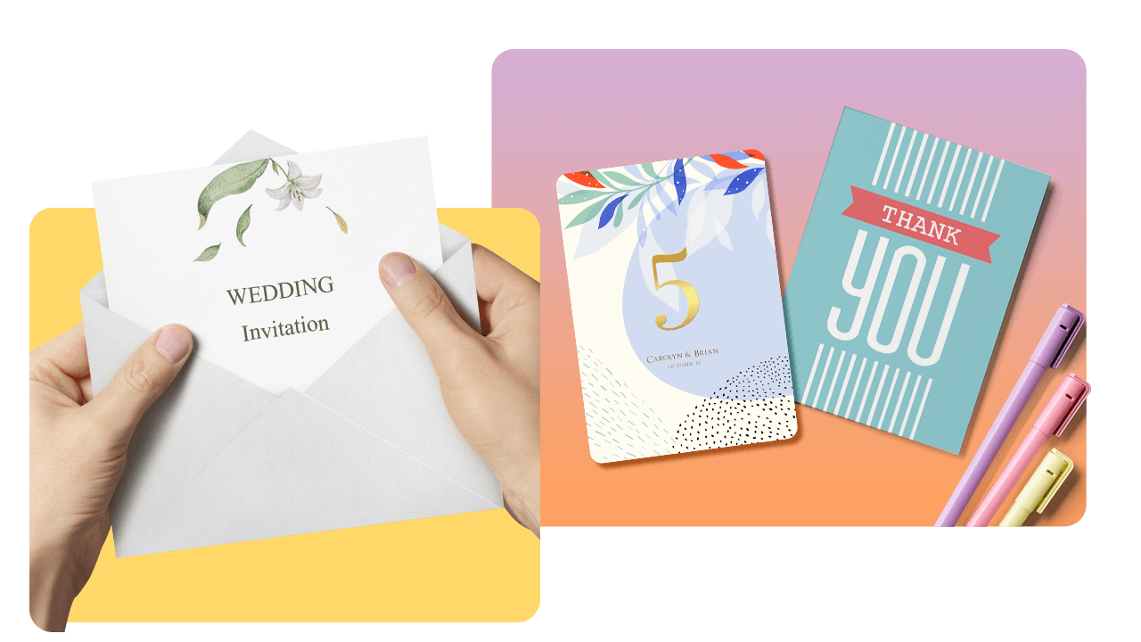 Hands holding a wedding invitation in an envelope, next to a table with a table number card, thank you card, and colorful pens.