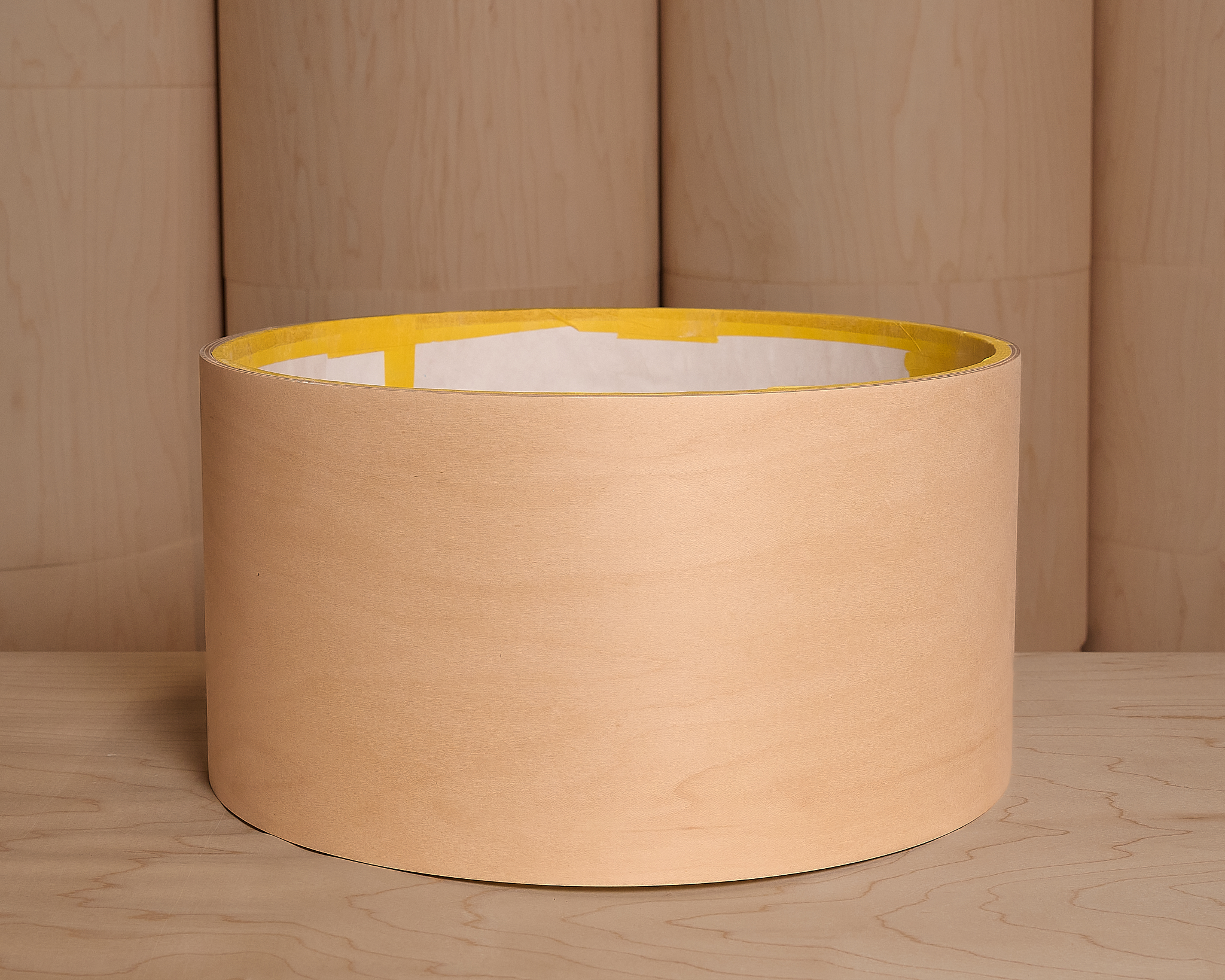 A raw sanded and masked maple drum shell