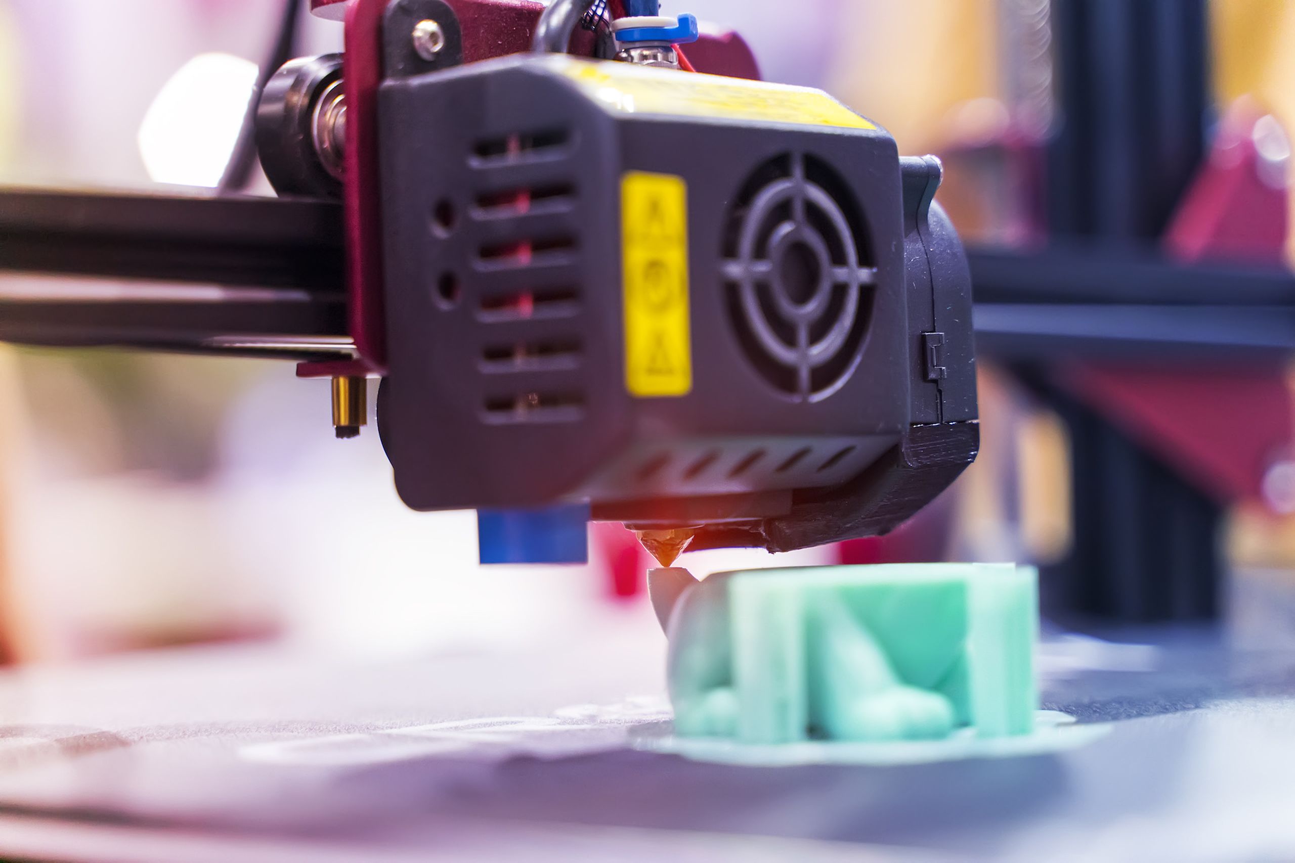 3D printer or additive manufacturing and robotic automation technology.