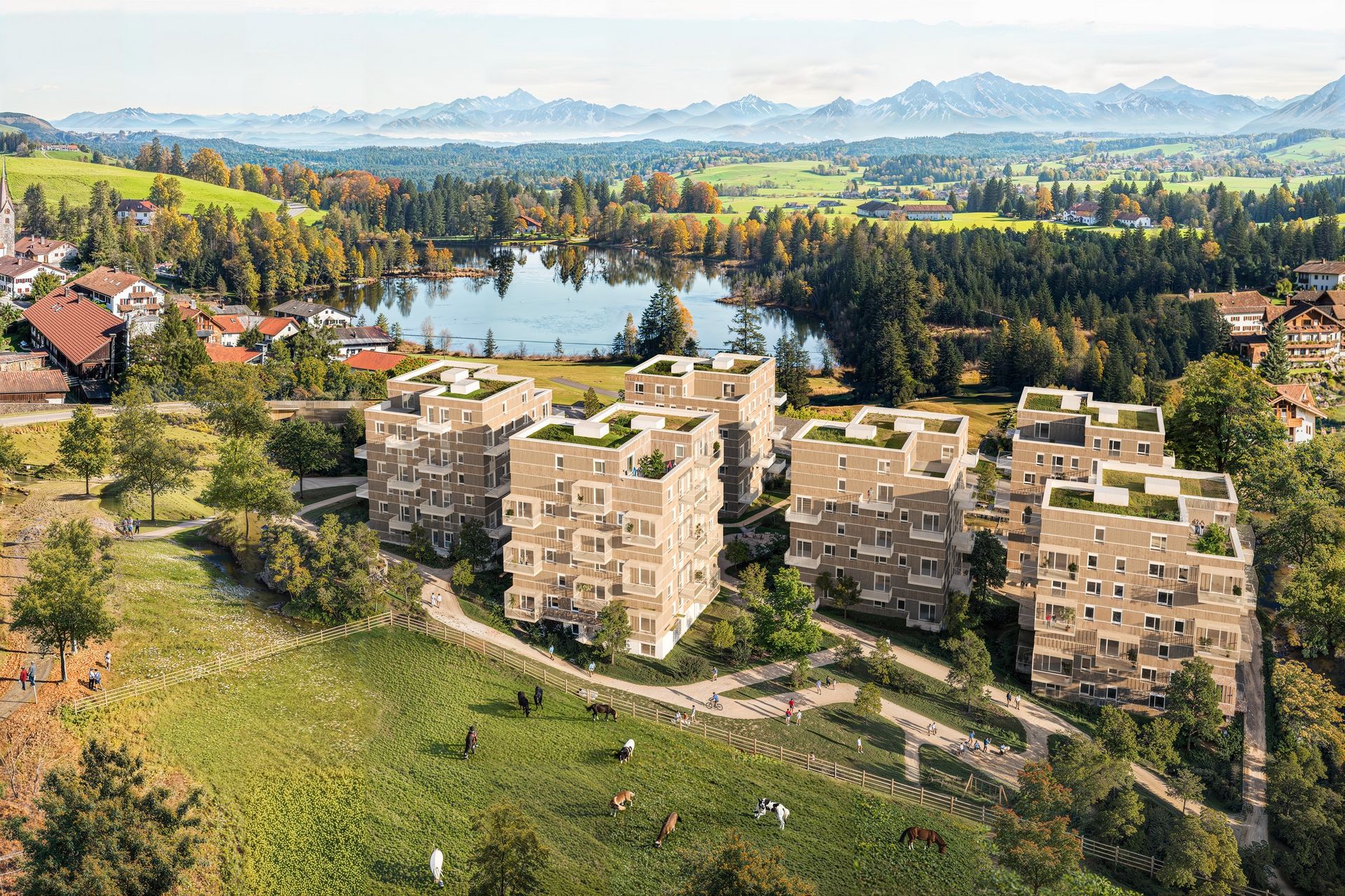 Rendering mit einer Siedlung aus Geiger Häusern mit Bergpanorama im Hintergrund.