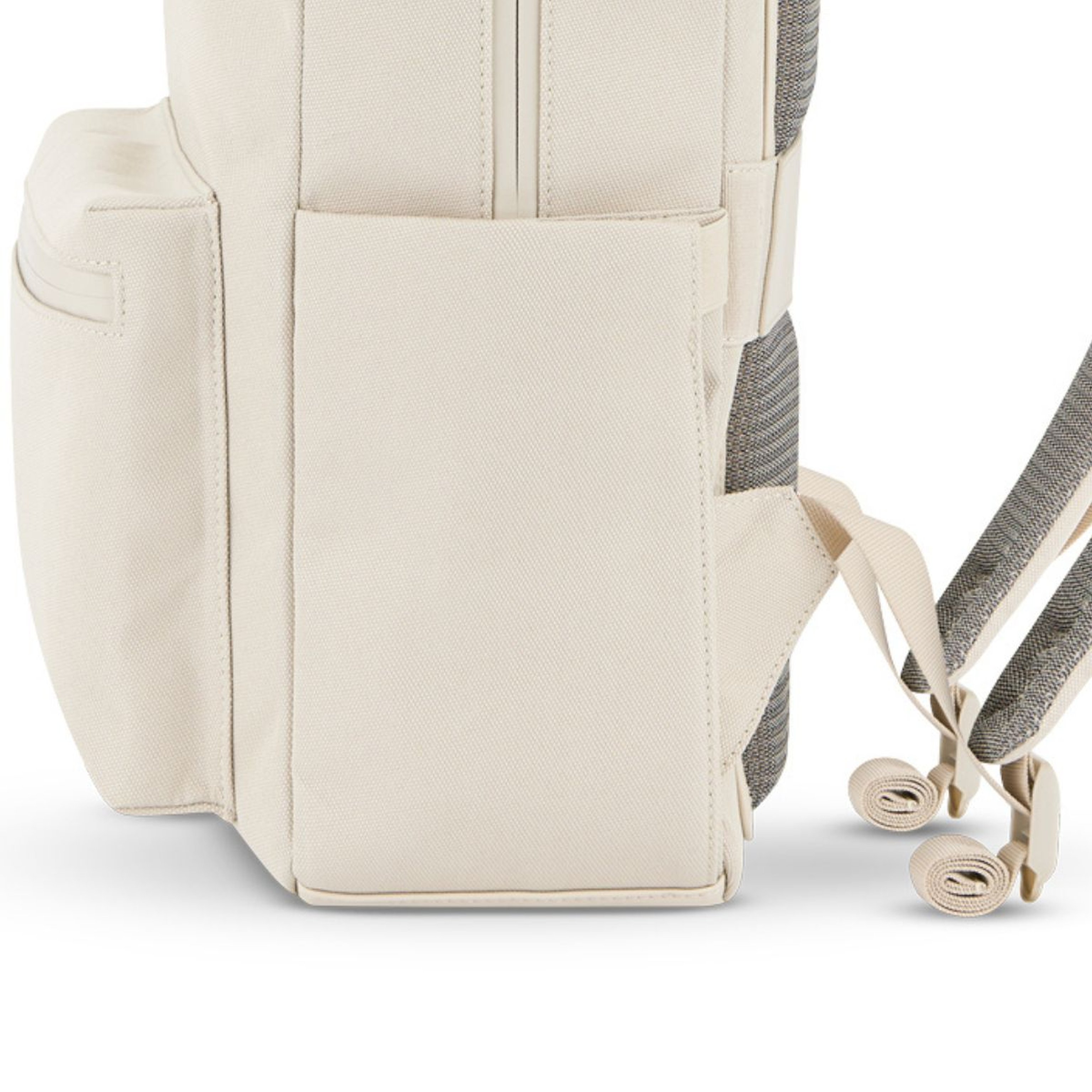 Close-up of a beige backpack showing the side pocket, padded shoulder straps, and adjustable buckles, conveying a sense of durability and functionality.