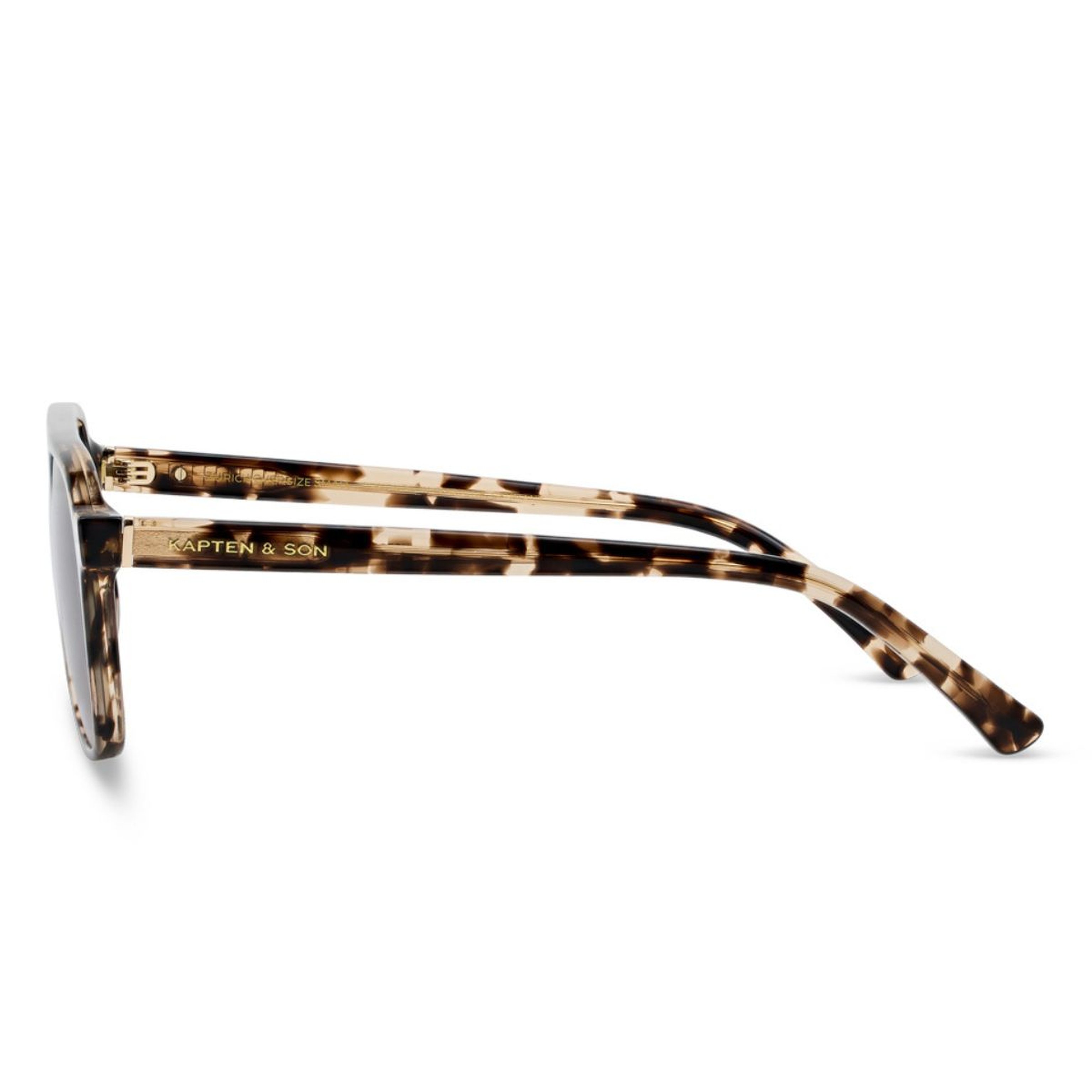 Side view of tortoiseshell sunglasses with "Kapten & Son" logo on the arms. The frame features a sleek design, conveying a modern, stylish tone.