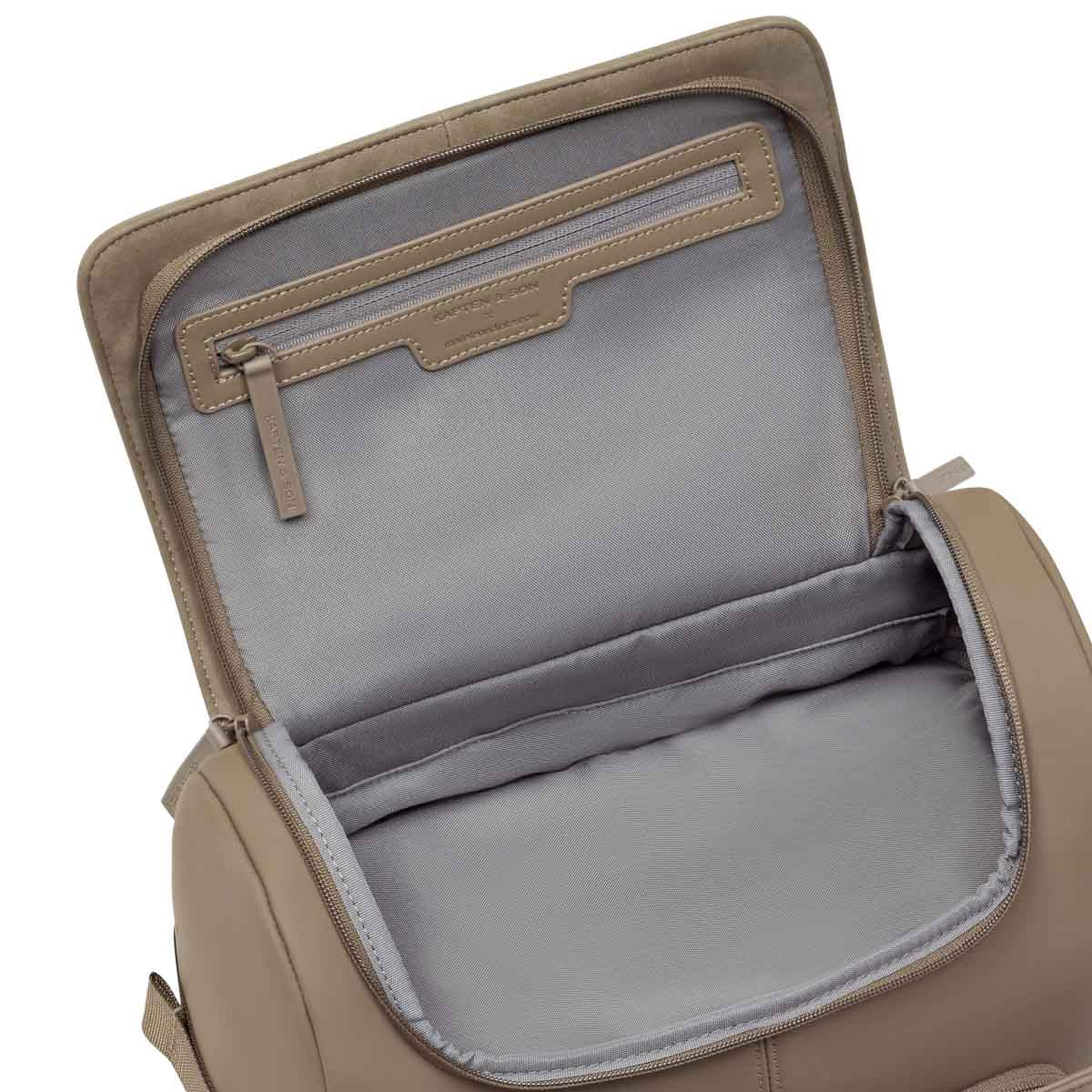 Open bag showing a spacious interior lined with light gray fabric. The upper flap has a zippered pocket for organization, conveying practicality.