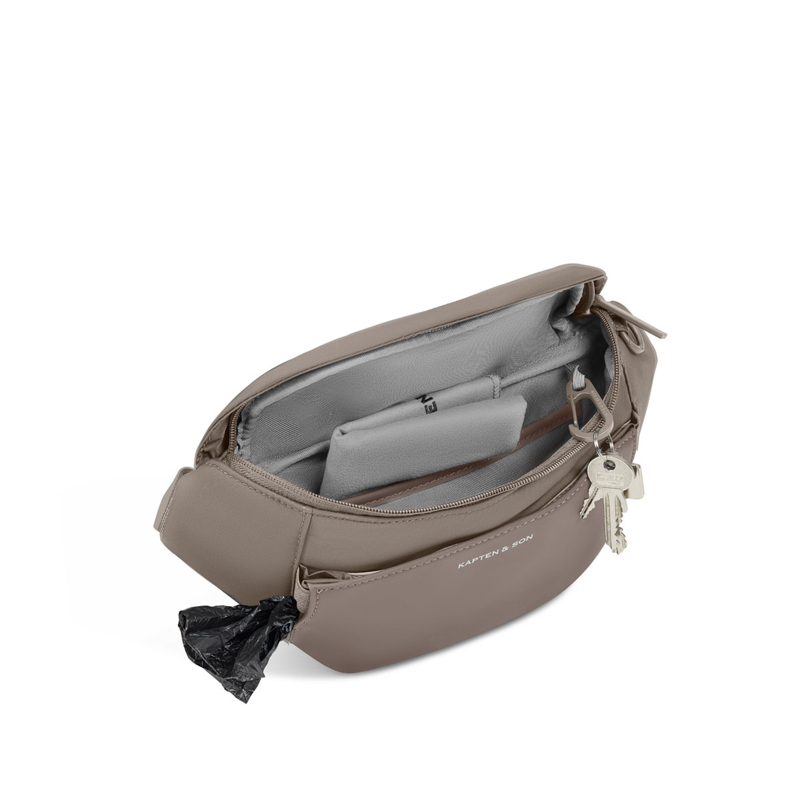 Geöffnete Hundetasche mit Innenfächern, einem gefalteten Tuch und Poop Bags.