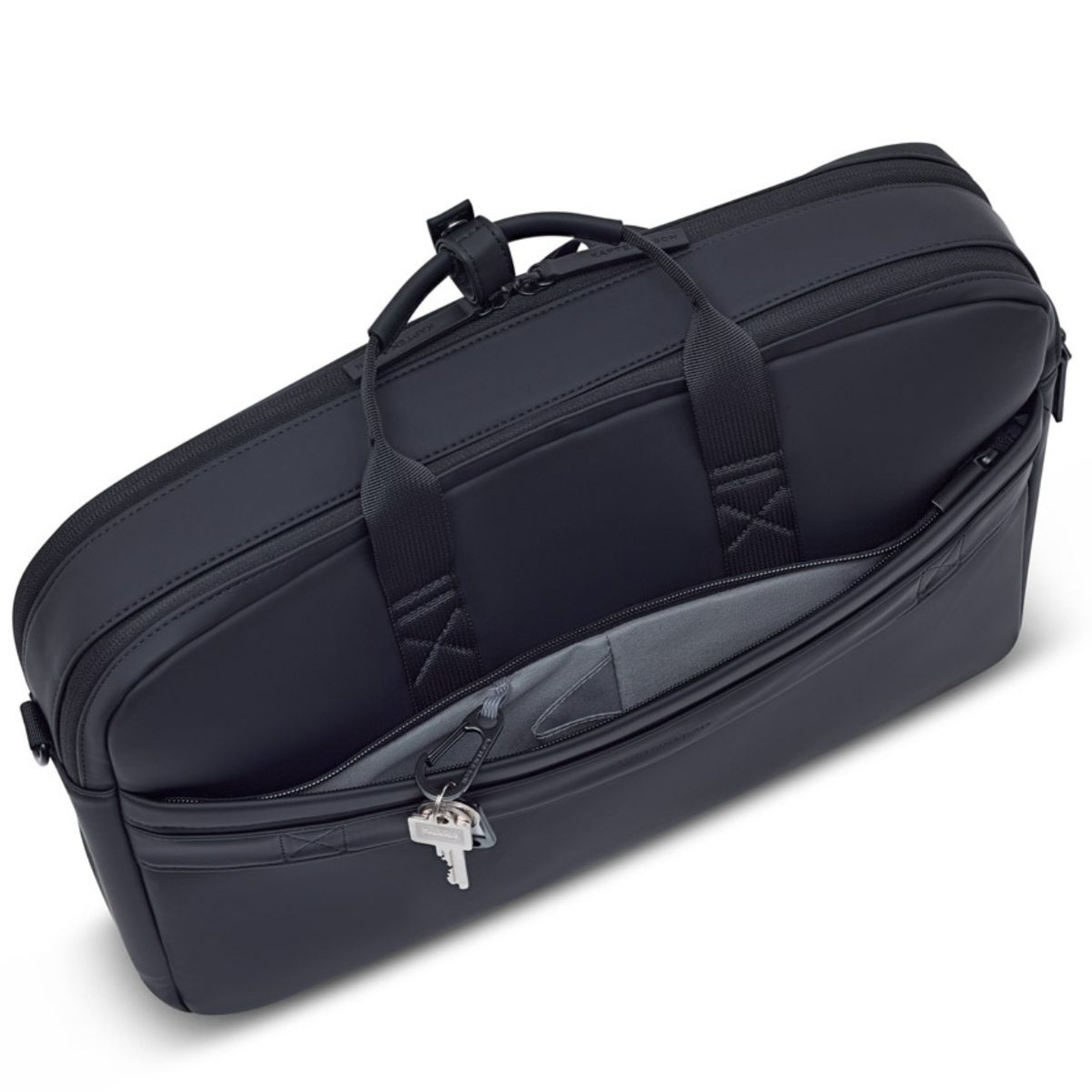 Sac pour ordinateur portable Kapten & Son vu de dessus avec le compartiment principal ouvert révélant un intérieur rembourré et des poches intérieures, clés attachées au curseur de la fermeture éclair, poignées de transport sur le dessus