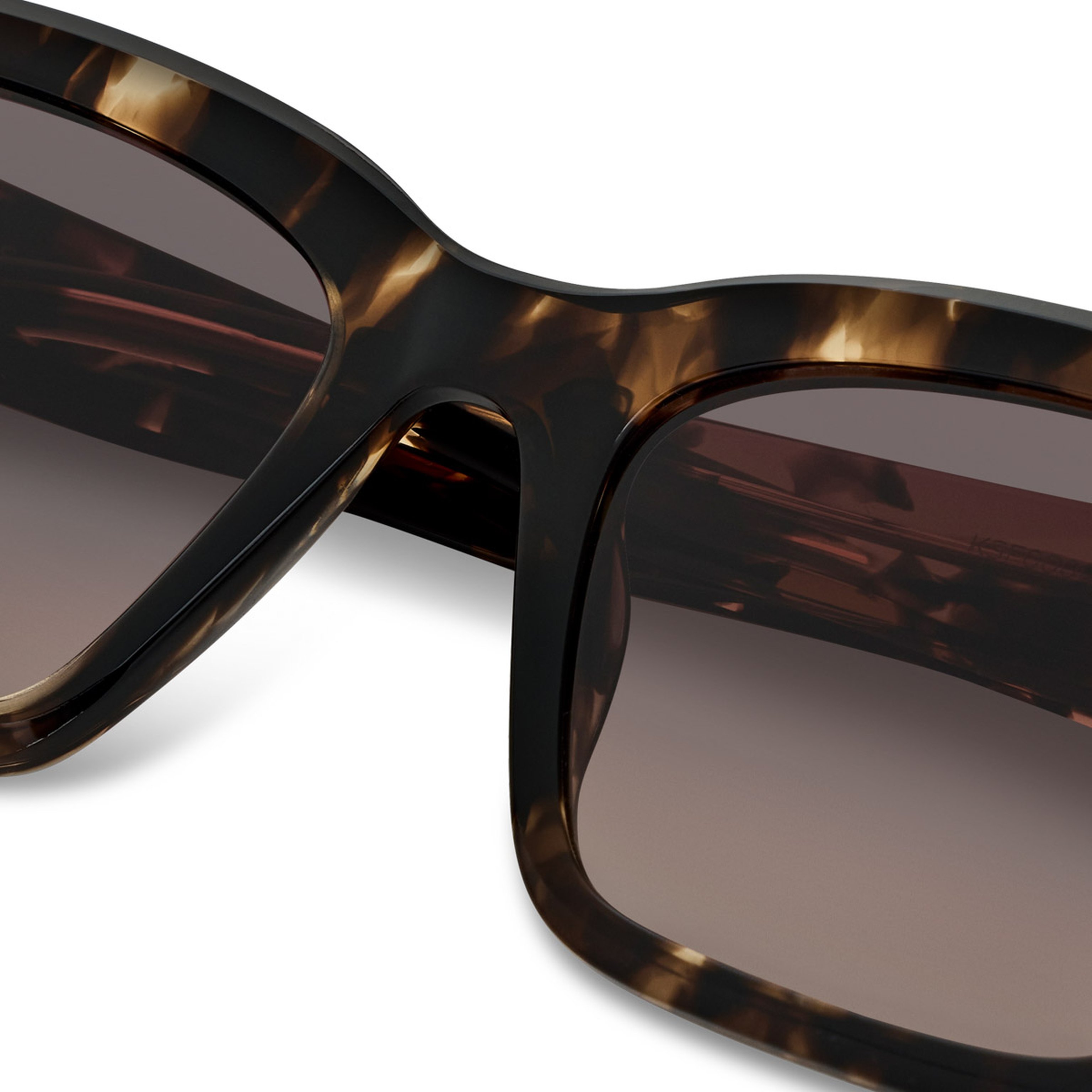 Brown rectangular sunglasses with gradient lenses transitioning from pink to beige. The frame is sturdy, giving a vintage, stylish vibe.