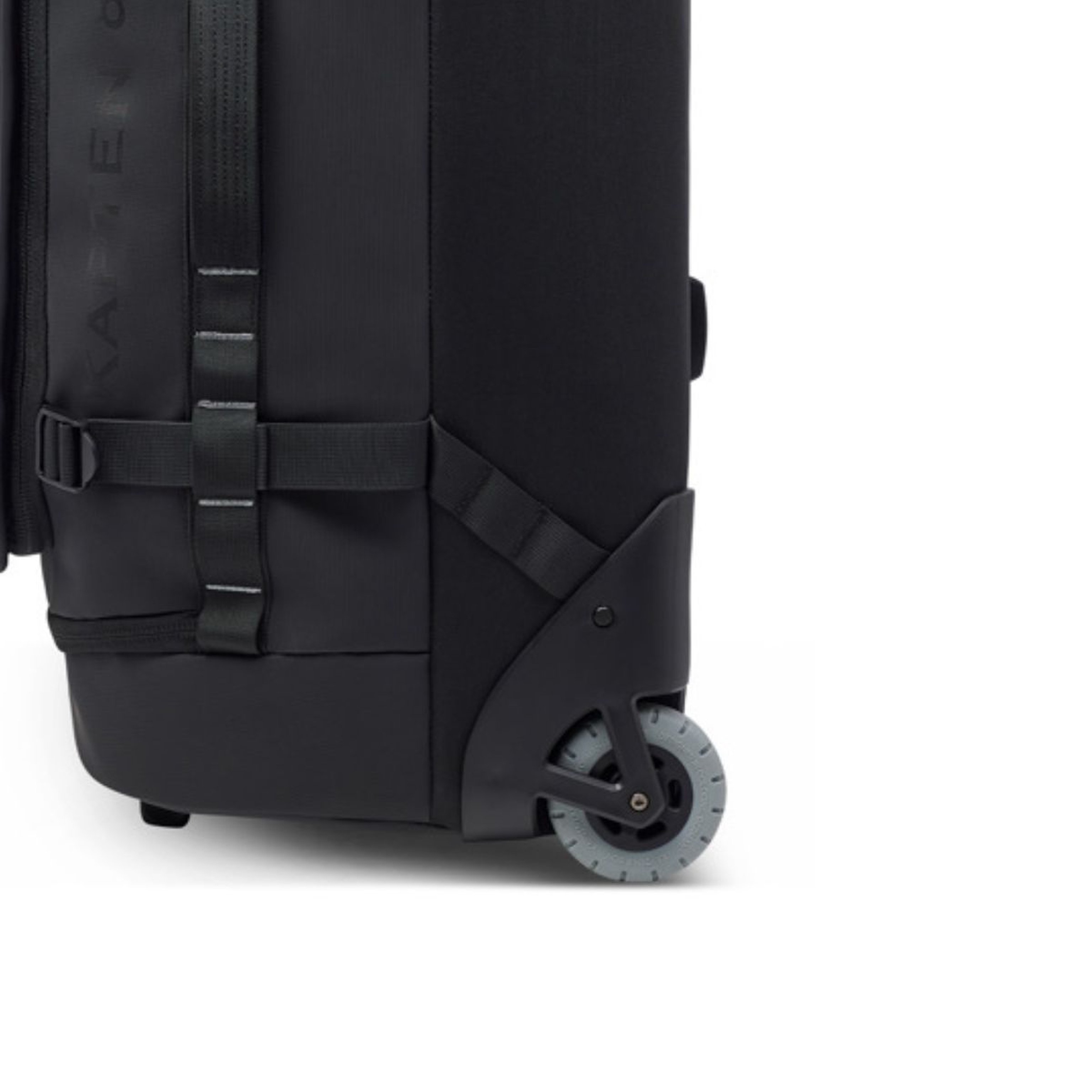 Close-up of a black wheeled suitcase with a textured surface. It features sturdy straps and a visible rolling wheel, suggesting durability and mobility.