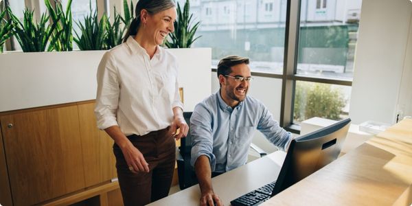 Lawyers working together on computer