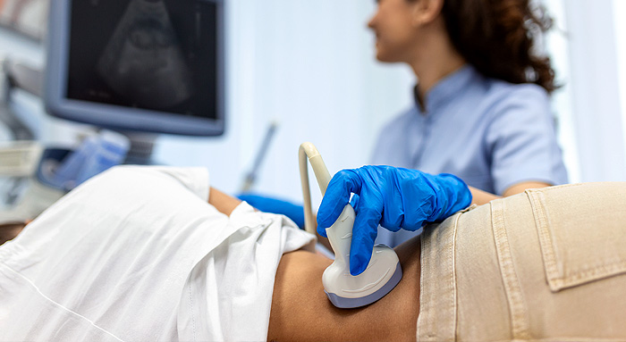 Kidneys being scanned by ultrasound probe
