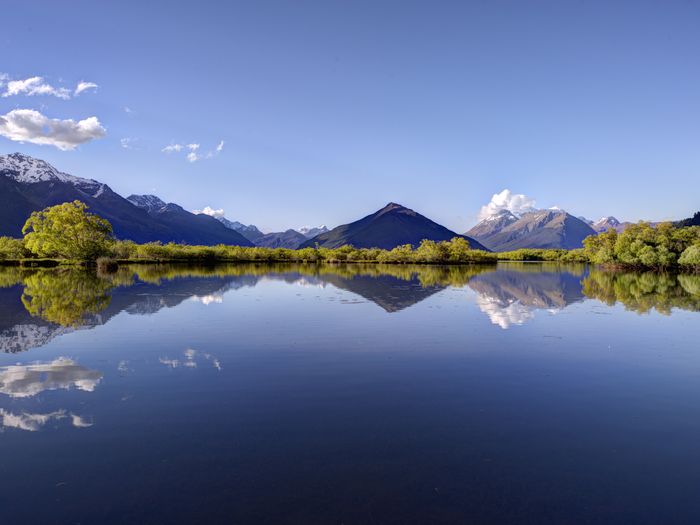 Reflections of the mountains in Lake Whakatipu in Glenorchy.