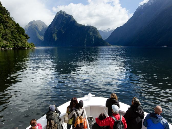 People on a boat cruising Milford Sound