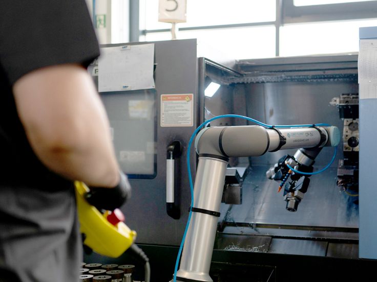 Universal Robots cobot arm working in a production environment