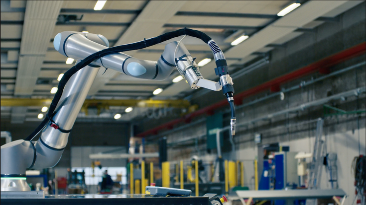 Universal Robots cobot equipped with a welding application, demonstrating seamless integration of UR+ certified solutions for advanced automation and flexible industrial workflows.
