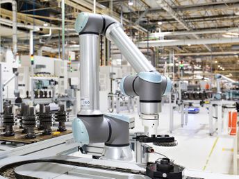 Cobot performing machine tending