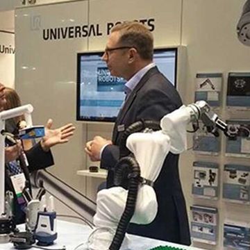 President of Universal Robots Jürgen von Hollen discusses the expanding UR+ platform with Engineering.com reporter Jim Anderton. The UR3 displayed has no less than five UR+ products; gripper from OnRobot, force/torque sensor from Optoforce, protective cover from ROBO-GEAR, cable guidance from Igus and vision camera from SICK.