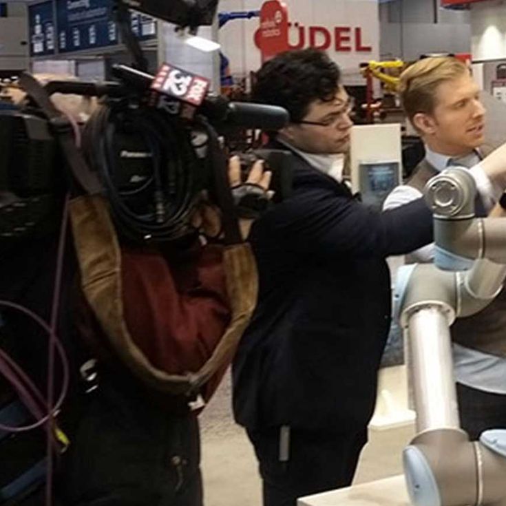 “So easy even a TV reporter can do it!”  Though the focus was on applications, we still had plenty of demo robots available to show attendees how they simply grab a robot arm and teach it a move. Viewers of Fox News in Chicago got a chance to find out too as our Technical Support Manager, Daniel Moore, taught reporter Jake Hamilton how it’s done.