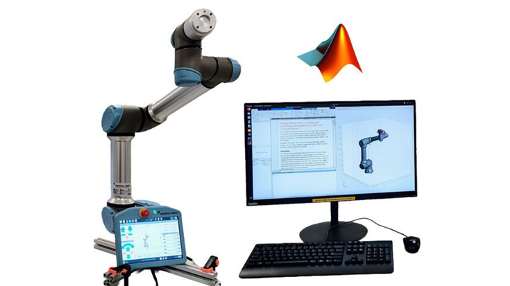 UR collaborative robot next to a workstation running MATLAB and Simulink, with a student observing robot motion