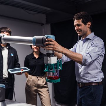 Fred Pareitti (CEO of MultiplyLabs) handling a collaborative robot