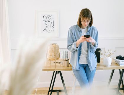 Woman sending text on her phone