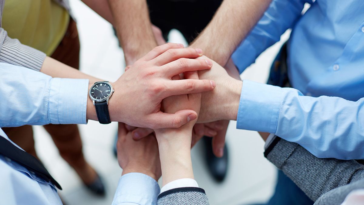People putting their hands together