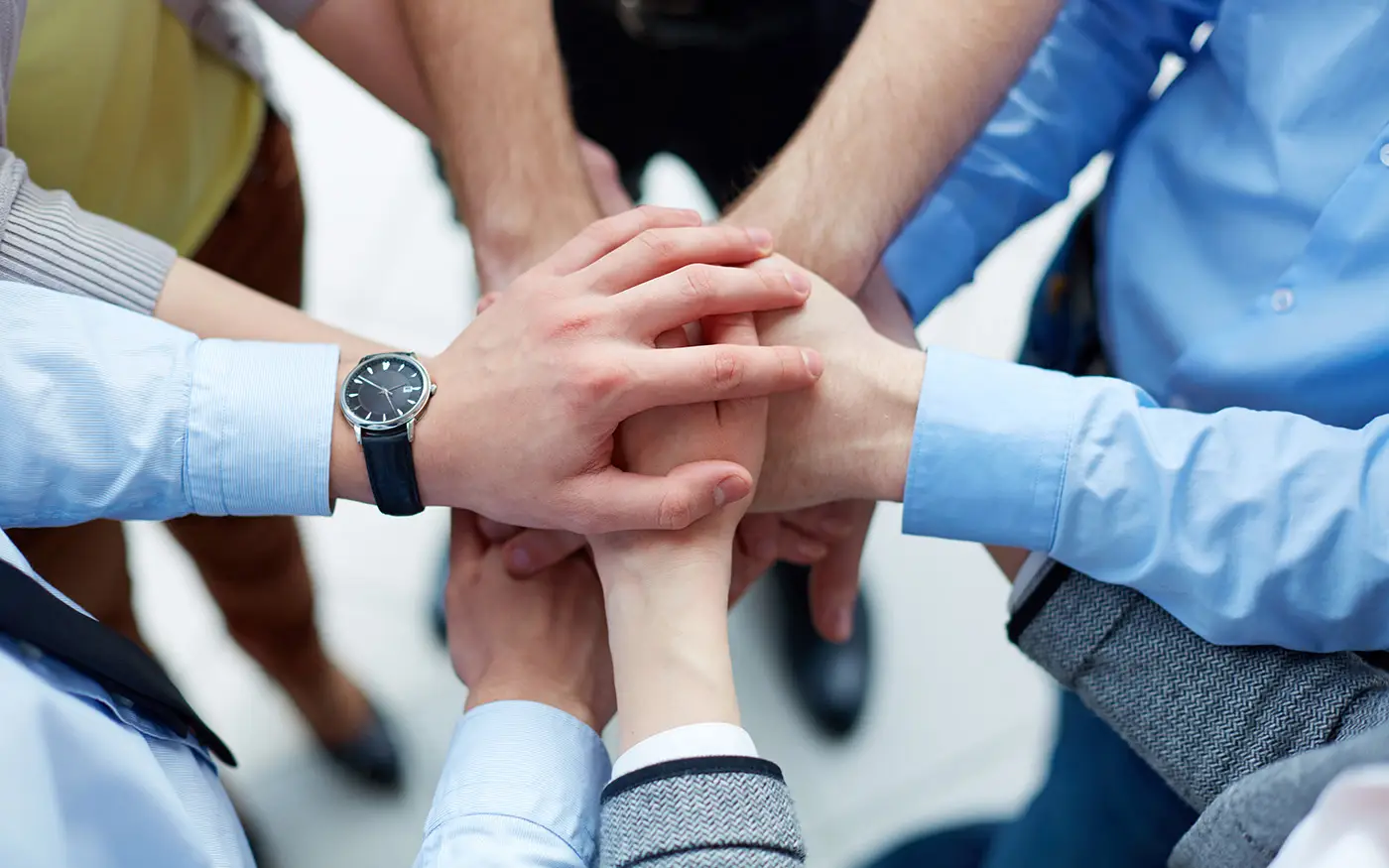 People putting their hands together