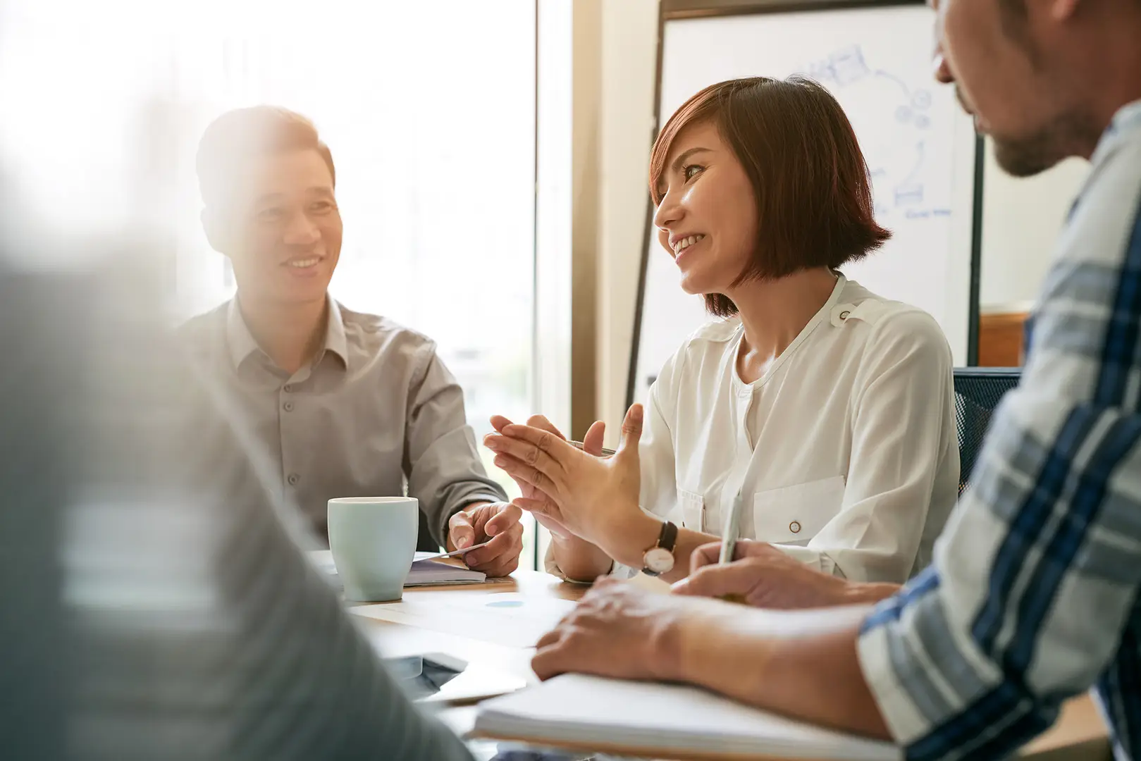 Young entrepreneur talks to her employees at meetings
