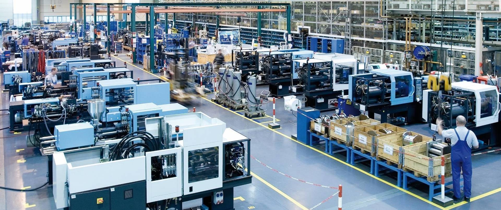 Sumitomo (SHI) Demag production line showcasing advanced injection molding machinery in operation, highlighting precision engineering and high-efficiency manufacturing processes.