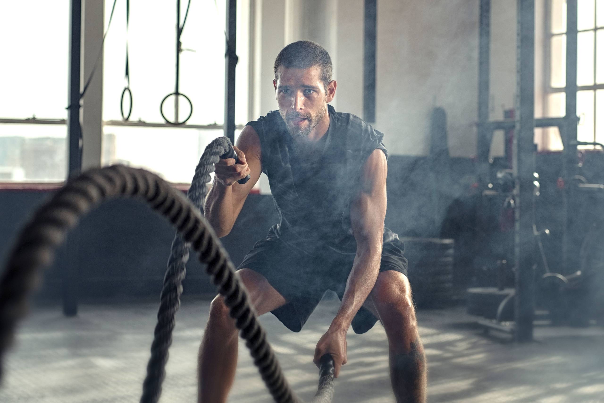 man training with ropes