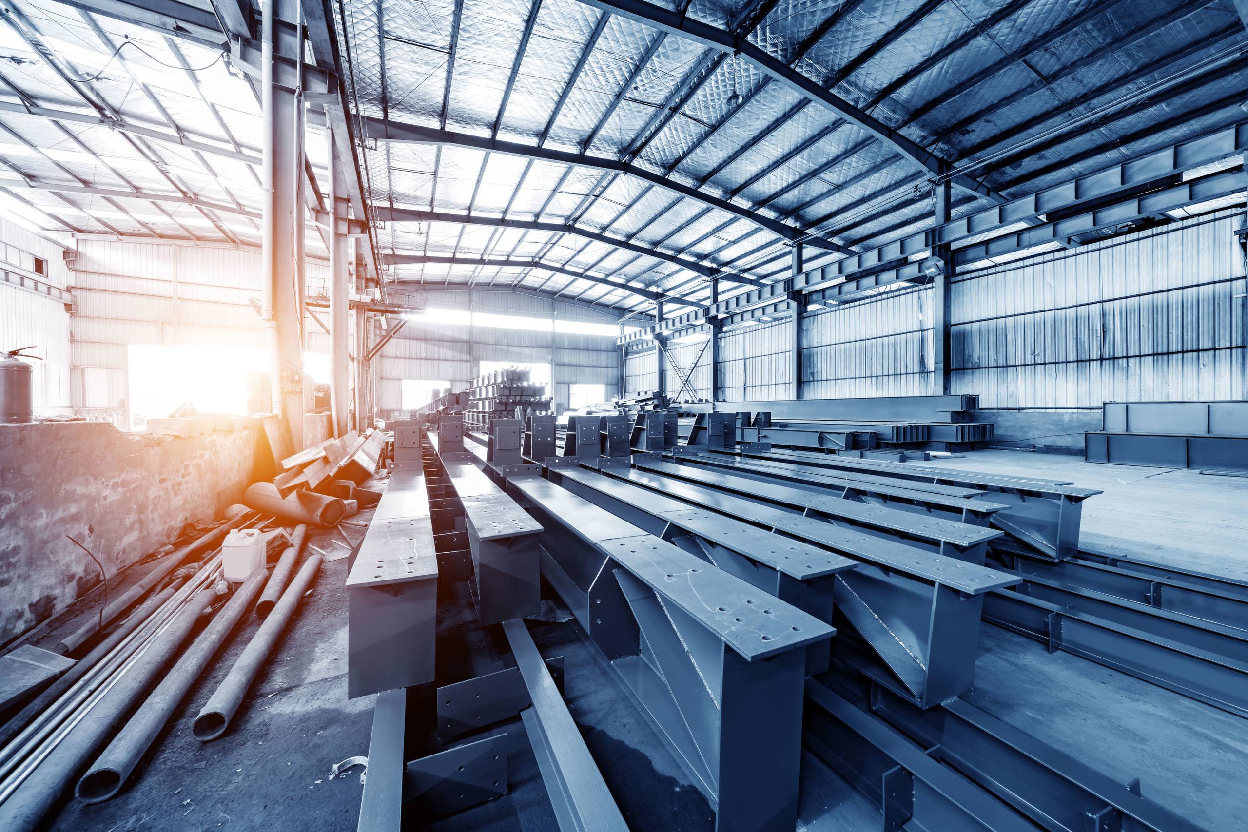 Steel factory floor, stacked with a lot of steel