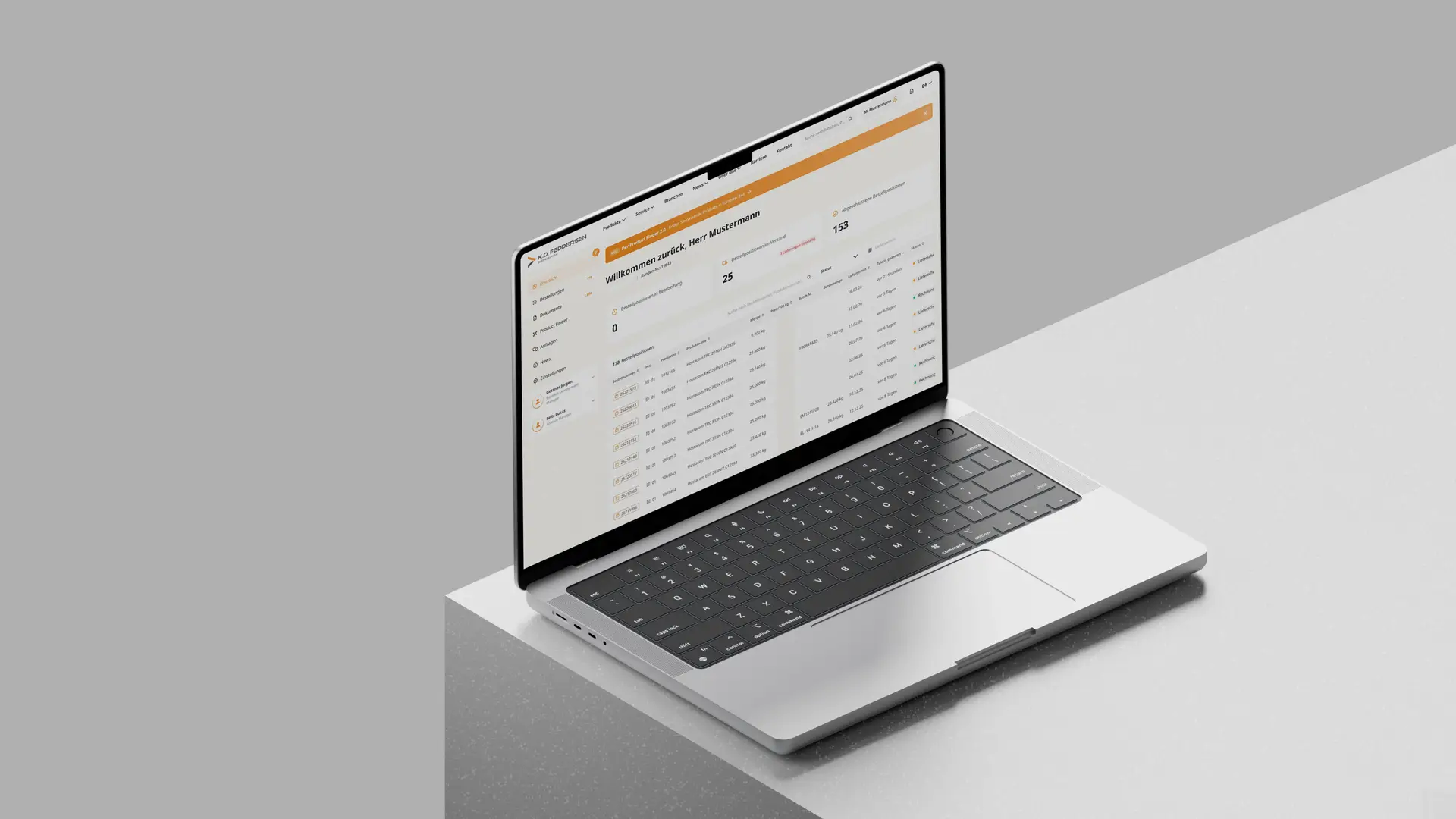 Open laptop on a textured gray surface displaying a spreadsheet-like document with orange and white headers on its screen.