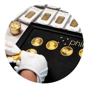 Handling von Goldmünzen und -barren