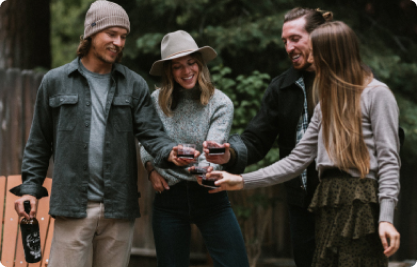 Group of people enjoying a glass of St Hubert's The Stag red wine