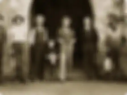 Group of people in front of Beringer Bro's distillery in the late 1800s