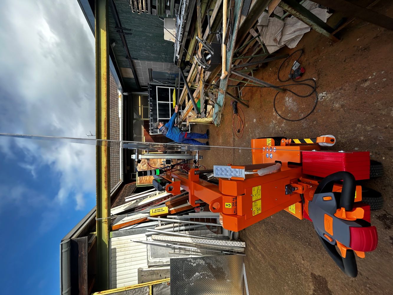 Smartlift vacuum lifter gripping a stainless steel sheet metal plate